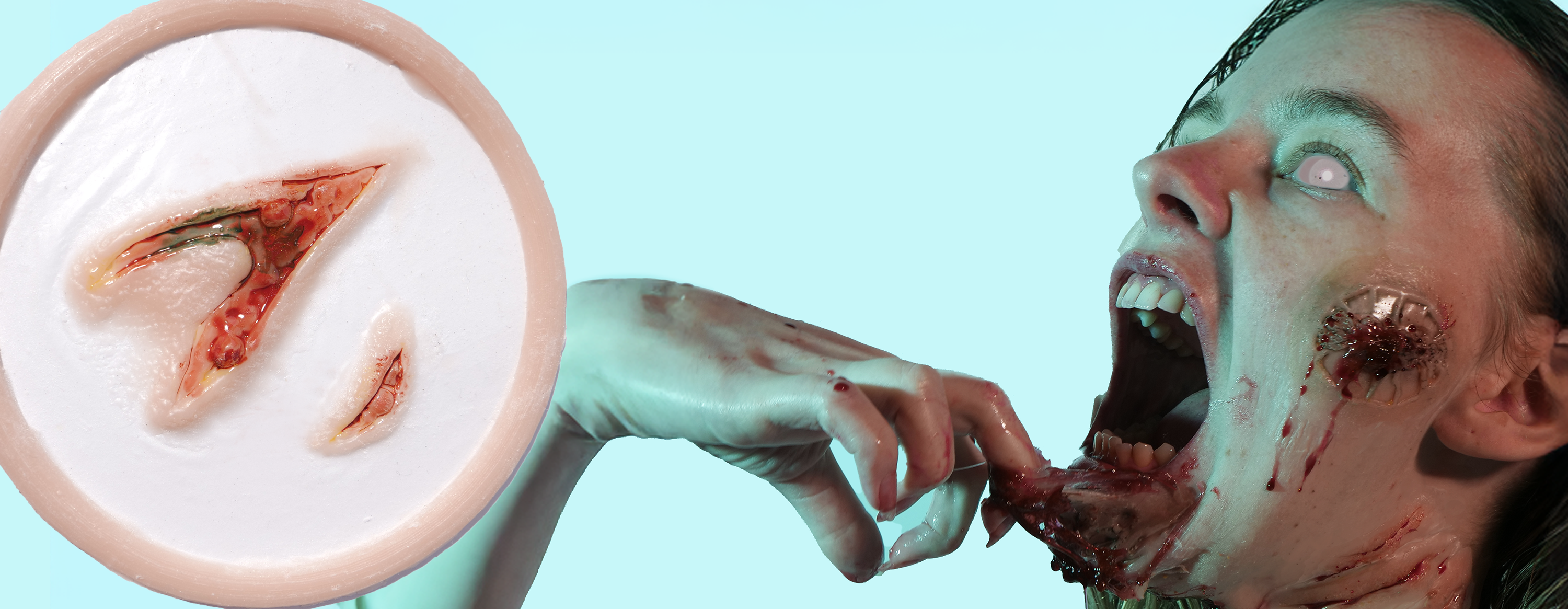 Horror scene with a zombie and silicone prosthetic, surrounded by blood and water.