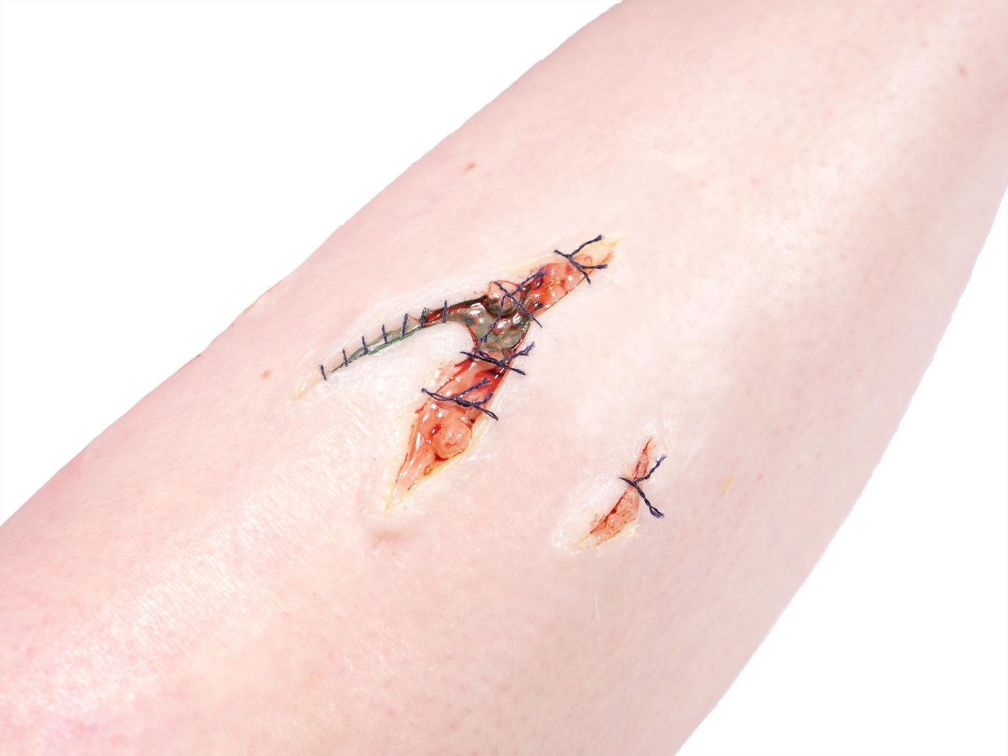 [Item 022: Laceration V-42S] — Pre-Painted Stitched Gash Prosthetic (Encapsulated Silicone)