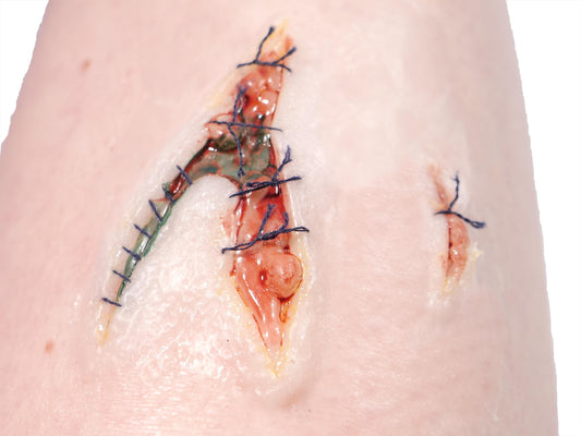 [Item 022: Laceration V-42S] — Pre-Painted Stitched Gash Prosthetic (Encapsulated Silicone)